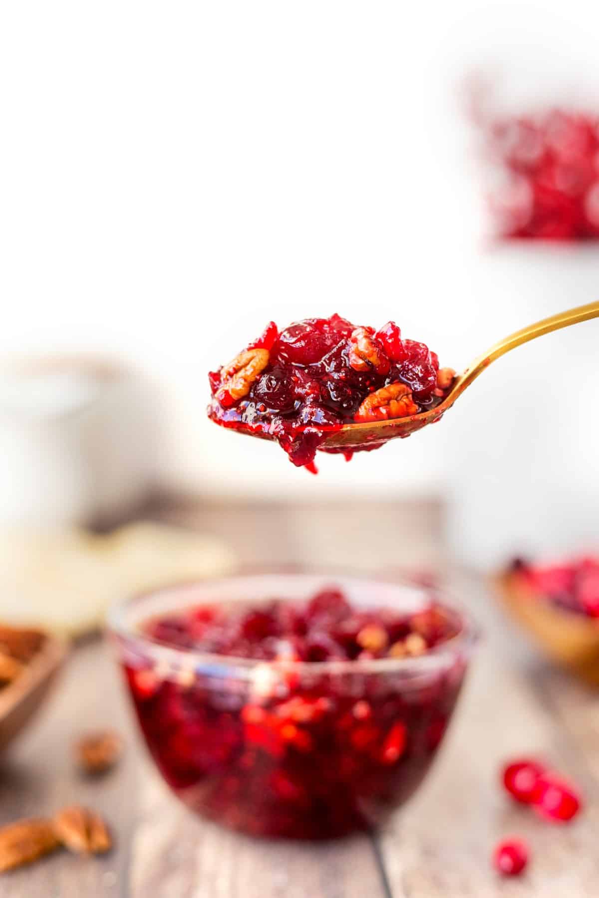 Spoonful of cranberry sauce with pecans. 