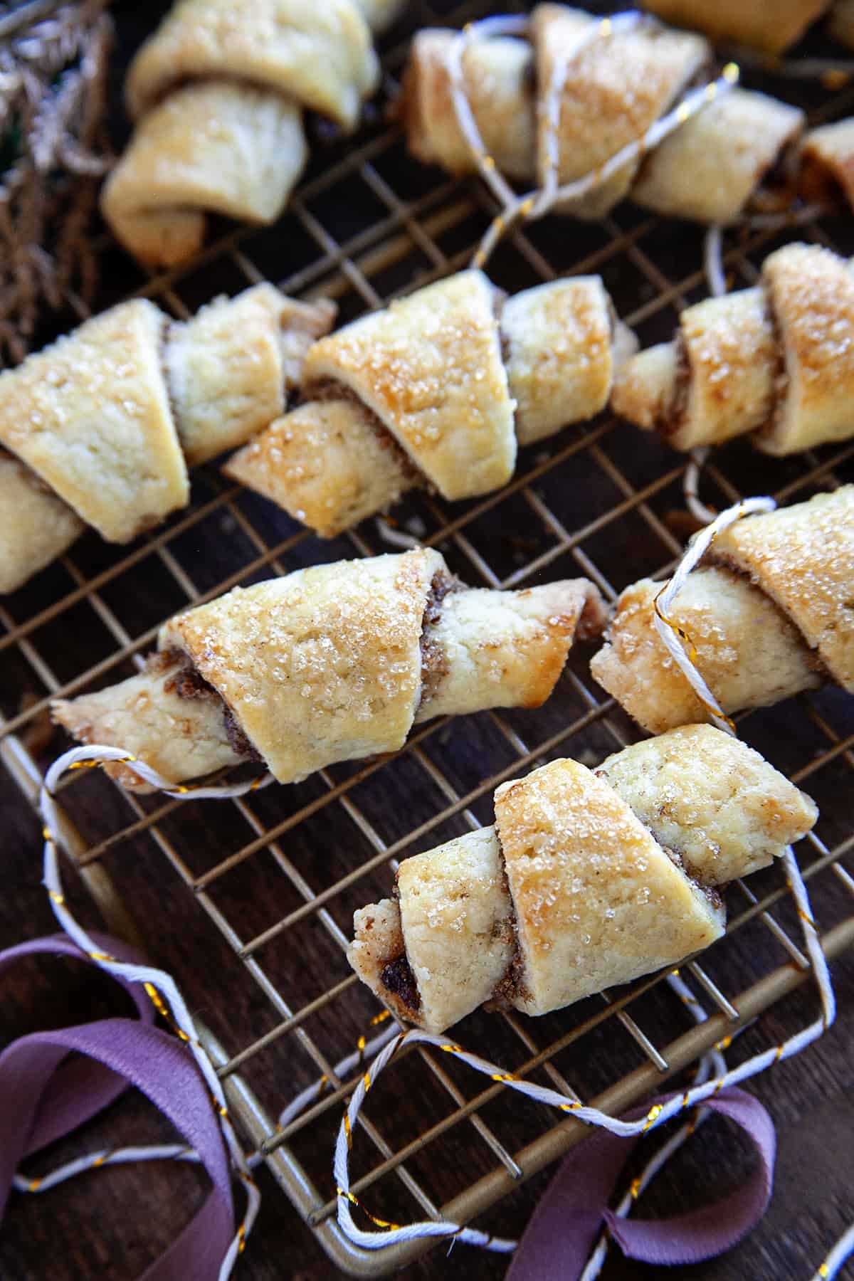 Rugelach on a cooling rack with string running through them. 