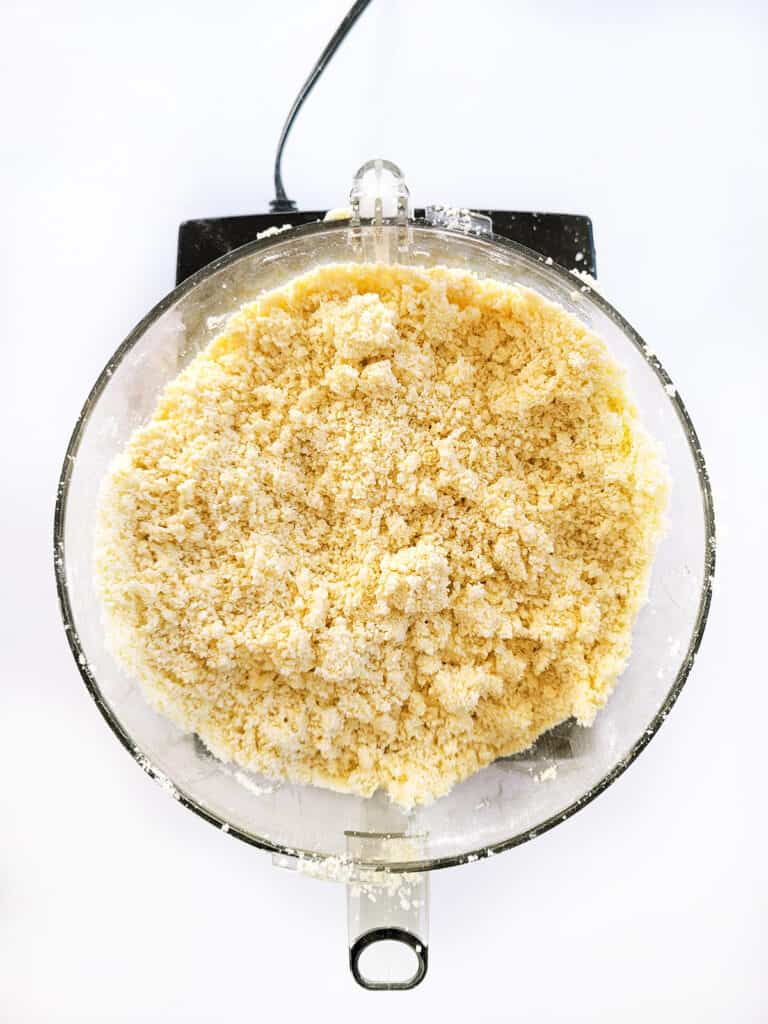Crumbly dough in a food processor. 