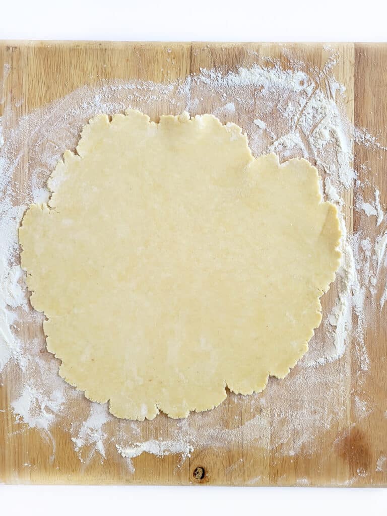 Dough rolled out into a circle. 
