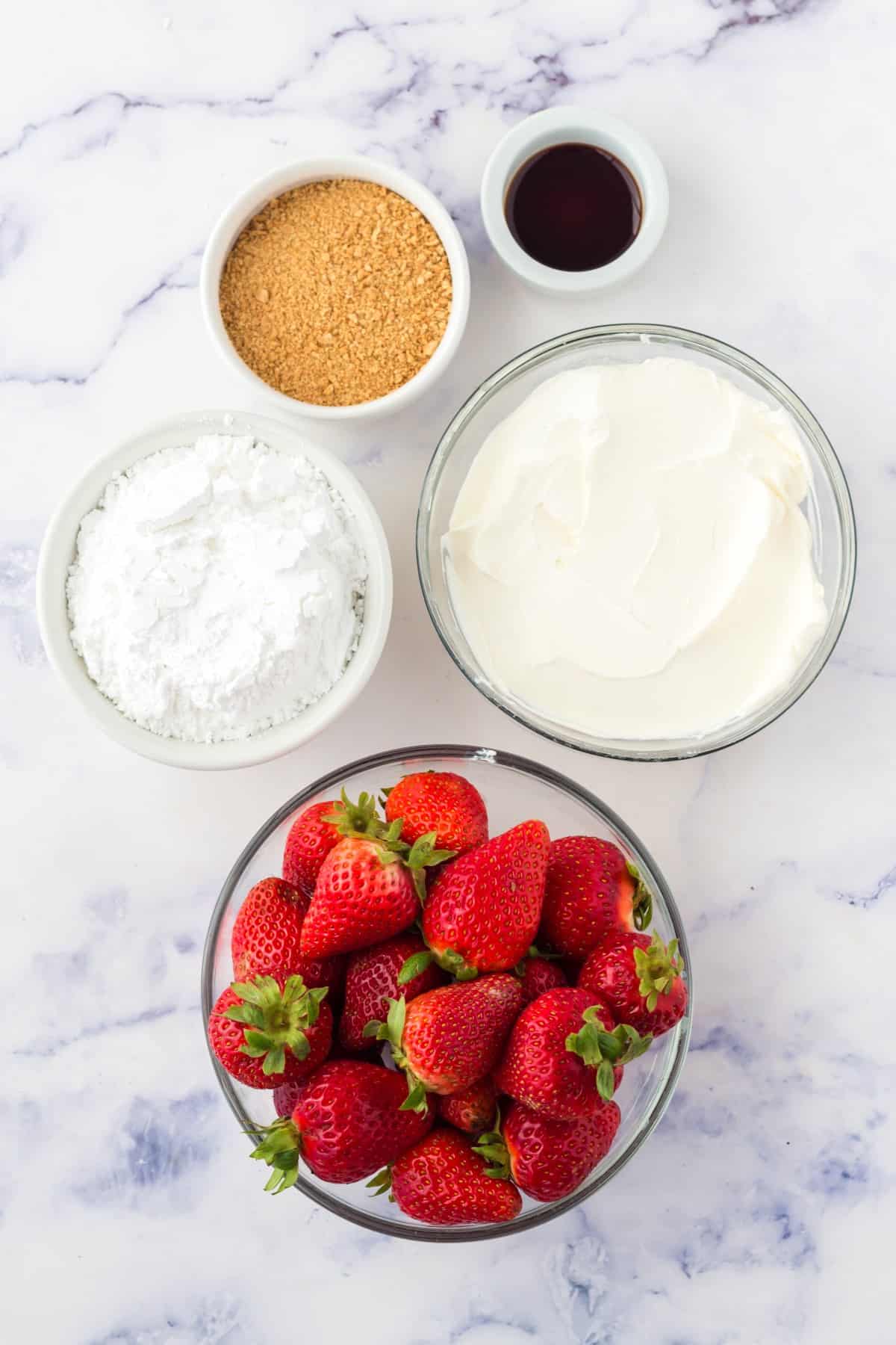 Ingredients for cheesecake stuffed strawberries. 