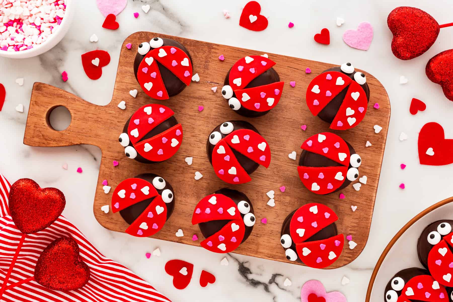 Horizontal shot of love bugs on a wooden board. 