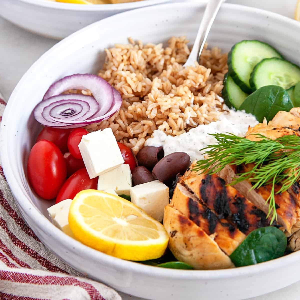 Sticking a fork in rice in a Greek Chicken Bowl. 