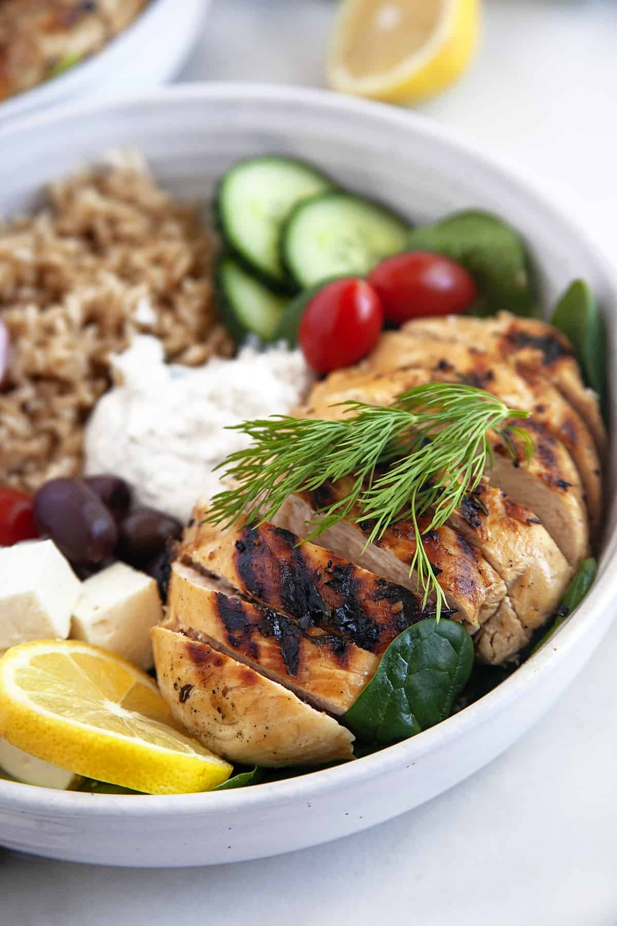 Close-up view of the grilled chicken in the bowl. 