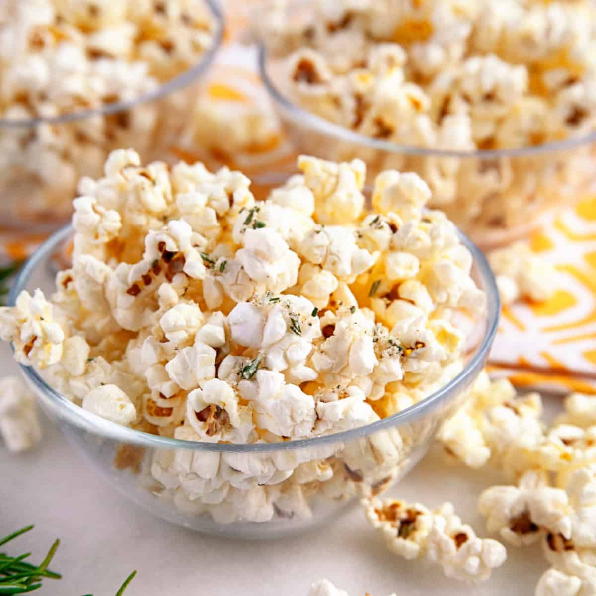 Olive oil popcorn in small glass bowls. 
