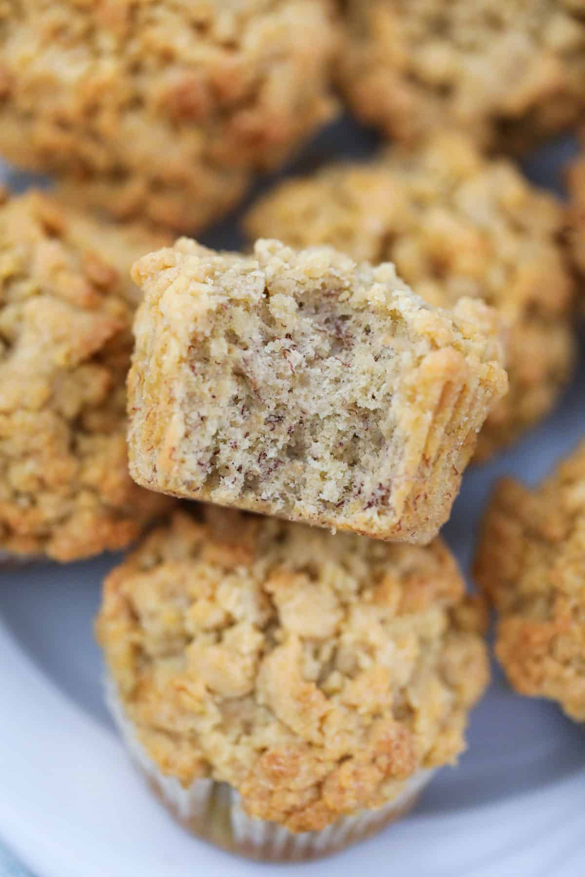 Close-up of a banana muffin with a bite taken. 