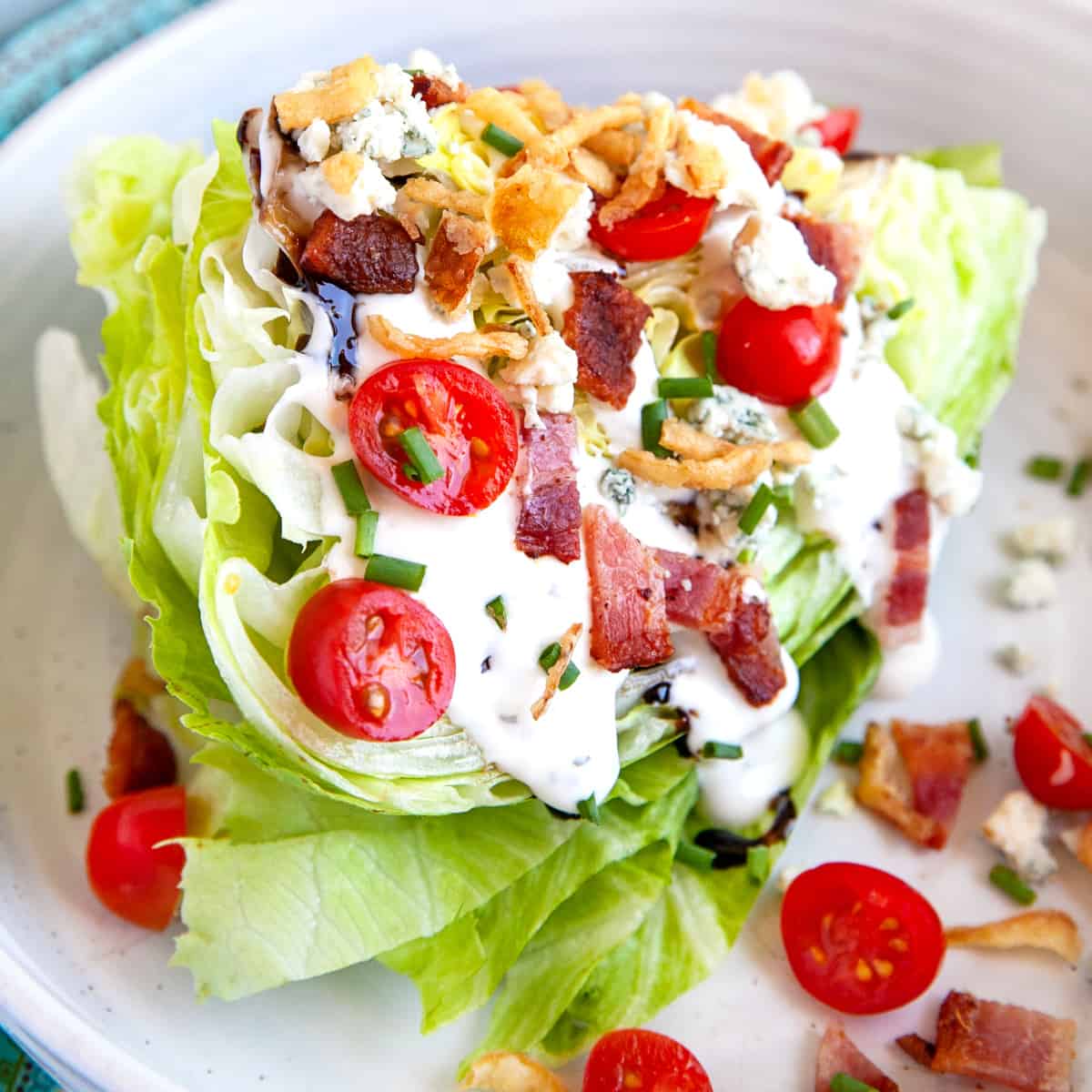 Wedge salad on a plate, square photo. 