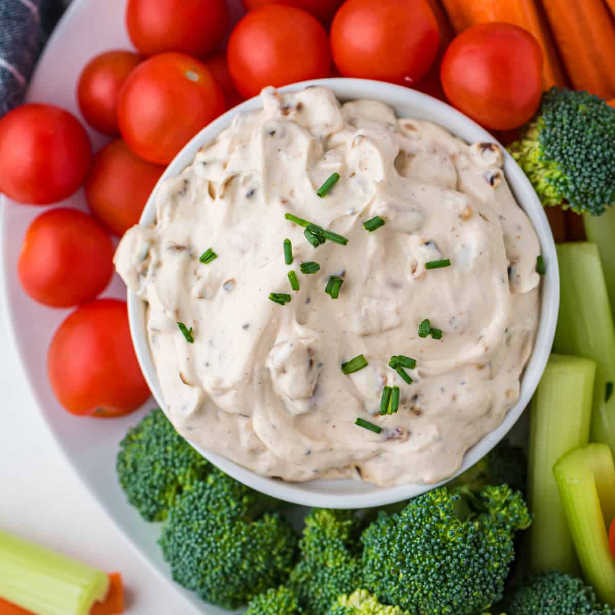 Square overhead photo of French Onion Dip with veggies. 