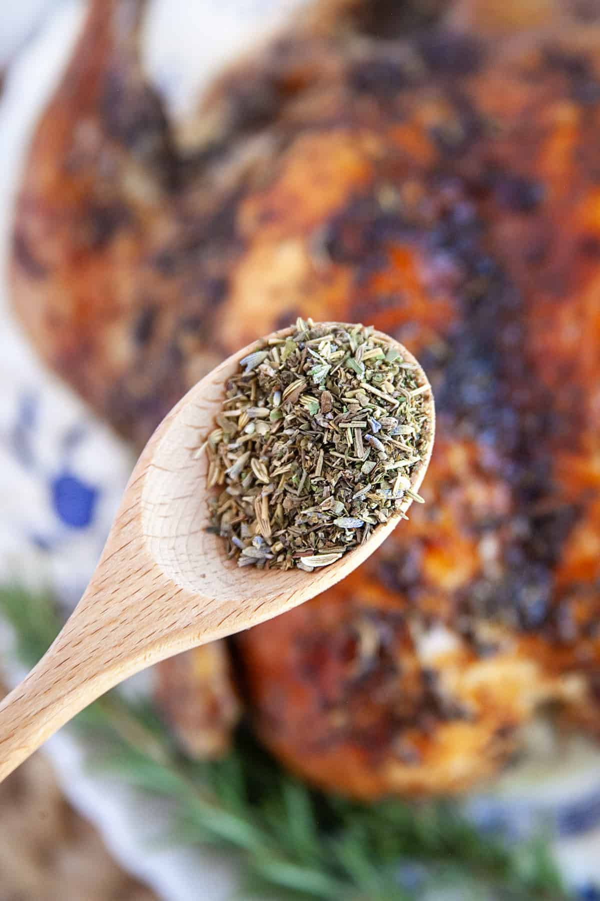 Herbs de Provence close-up on a wooden spoon. 