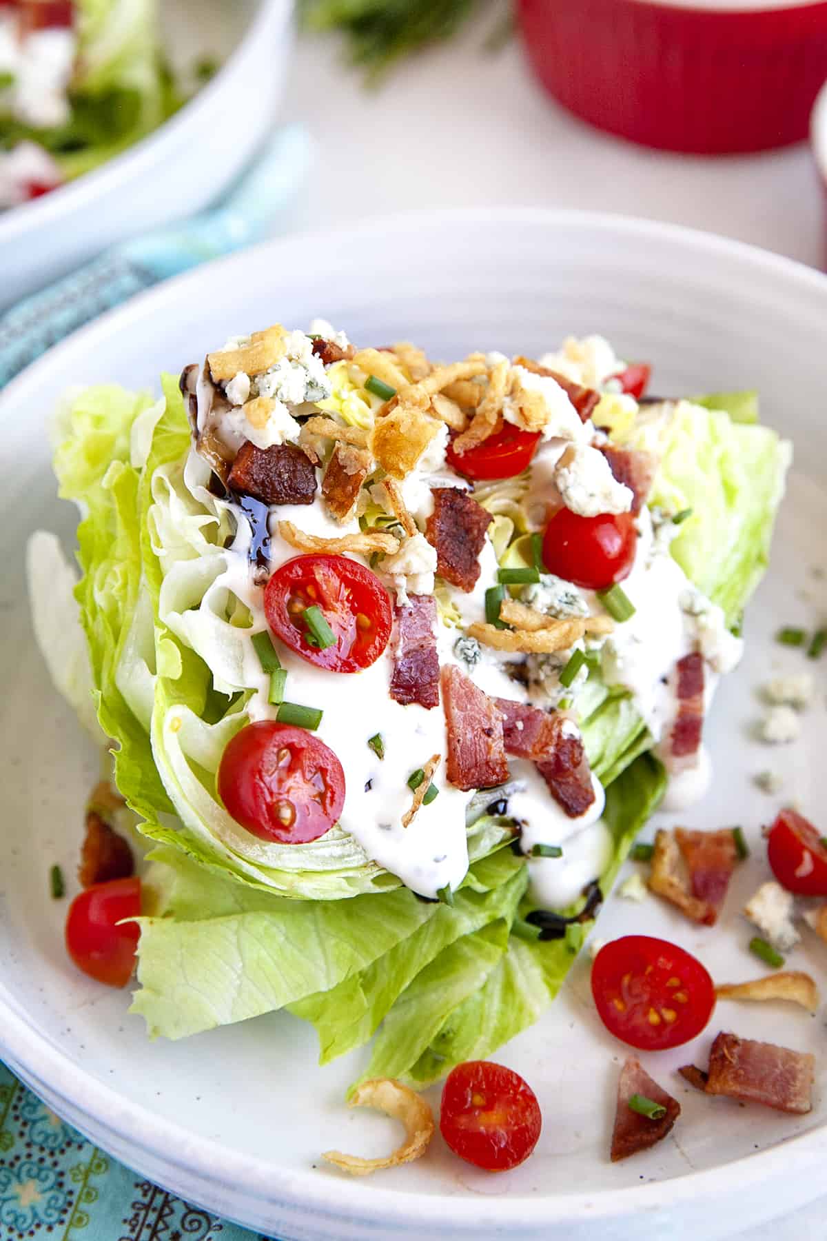 Wedge salad on a white plate.