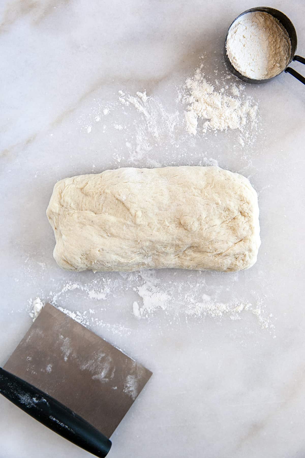 Bread dough shaped into a rectangle. 