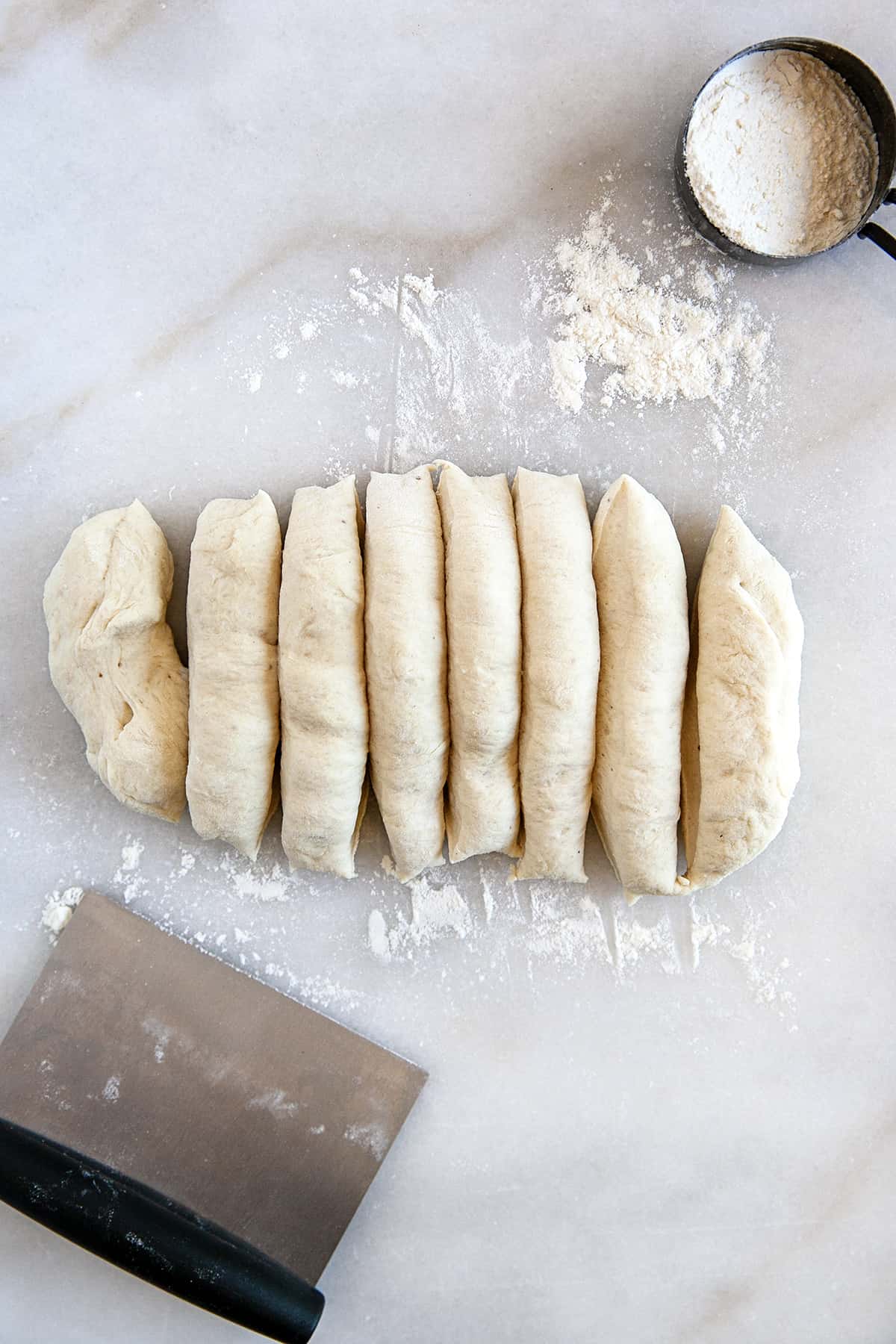 Bread dough cut into 8 sections. 