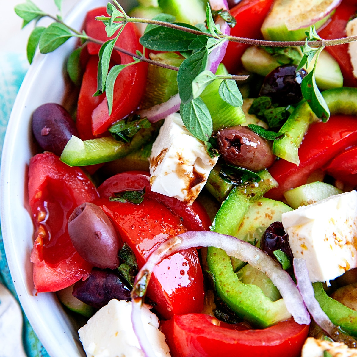 Square photo taken overhead of a classic Greek salad. 