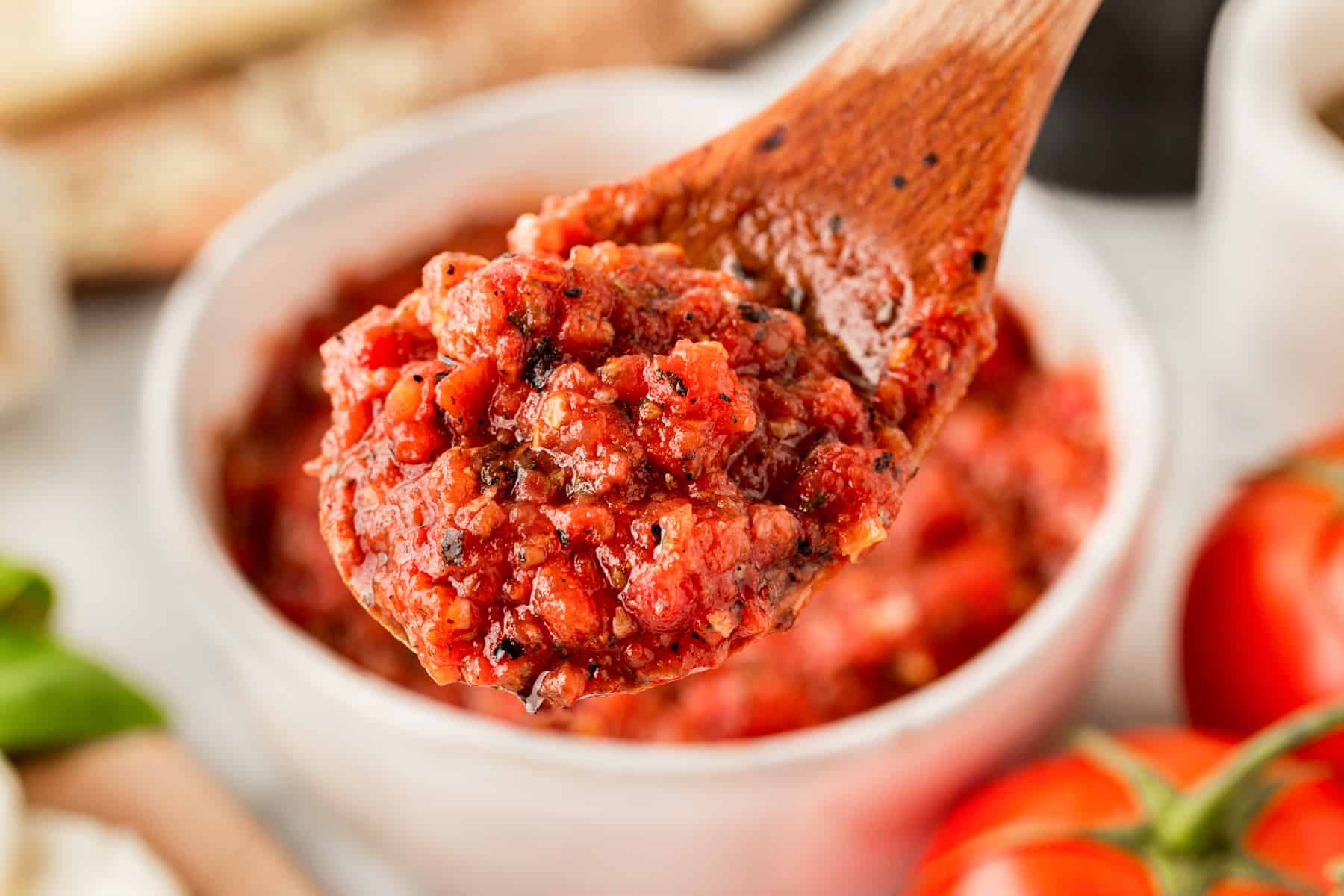 Horizontal picture of homemade sauce on a wooden spoon. 
