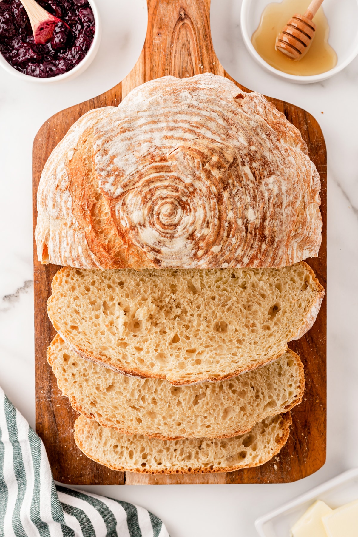 Bread overhead sliced on a board. 