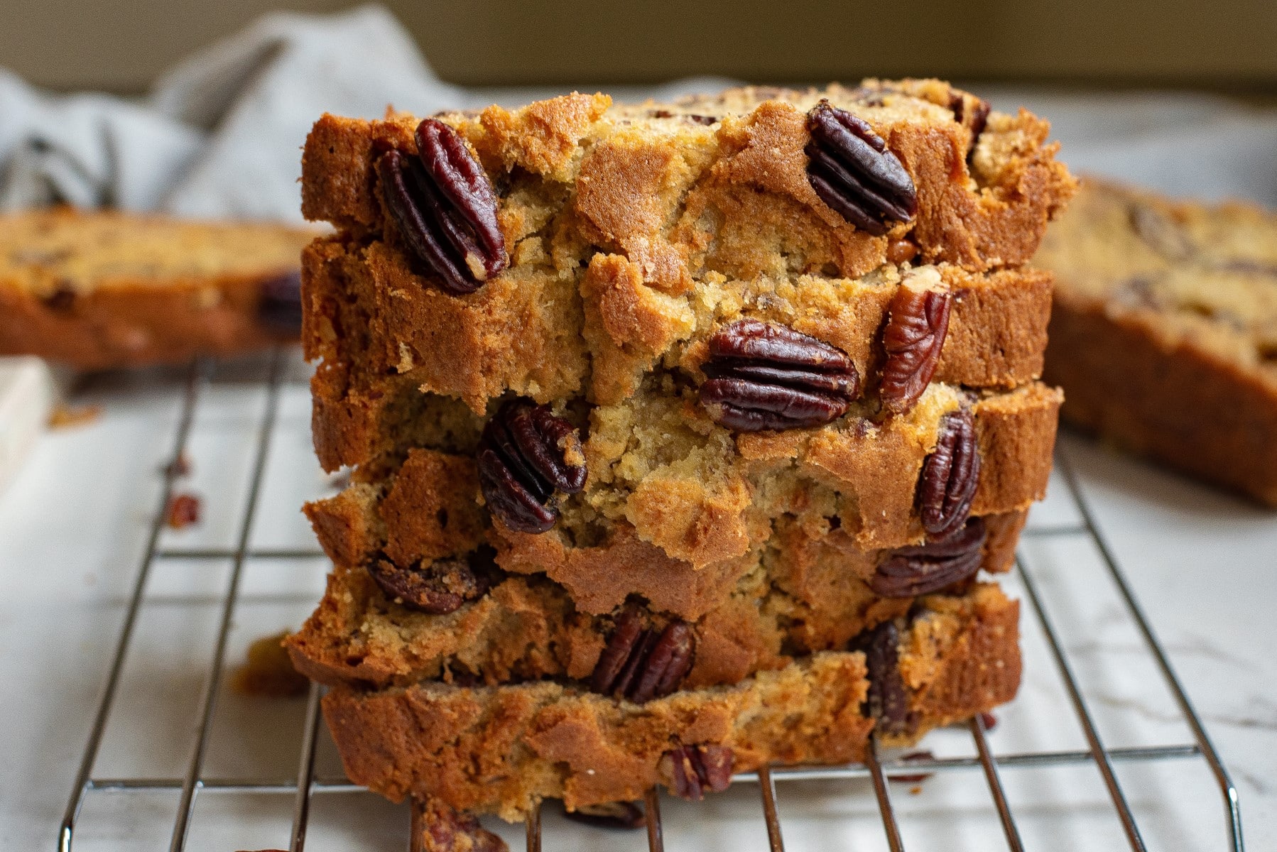 Horizontal picture of sliced stacked banana bread. 