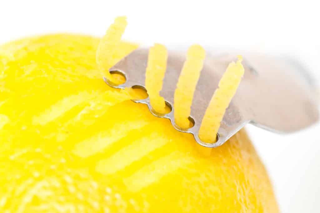 Lemon Getting Zested How to Zest a Lemon - Noshing With The Nolands