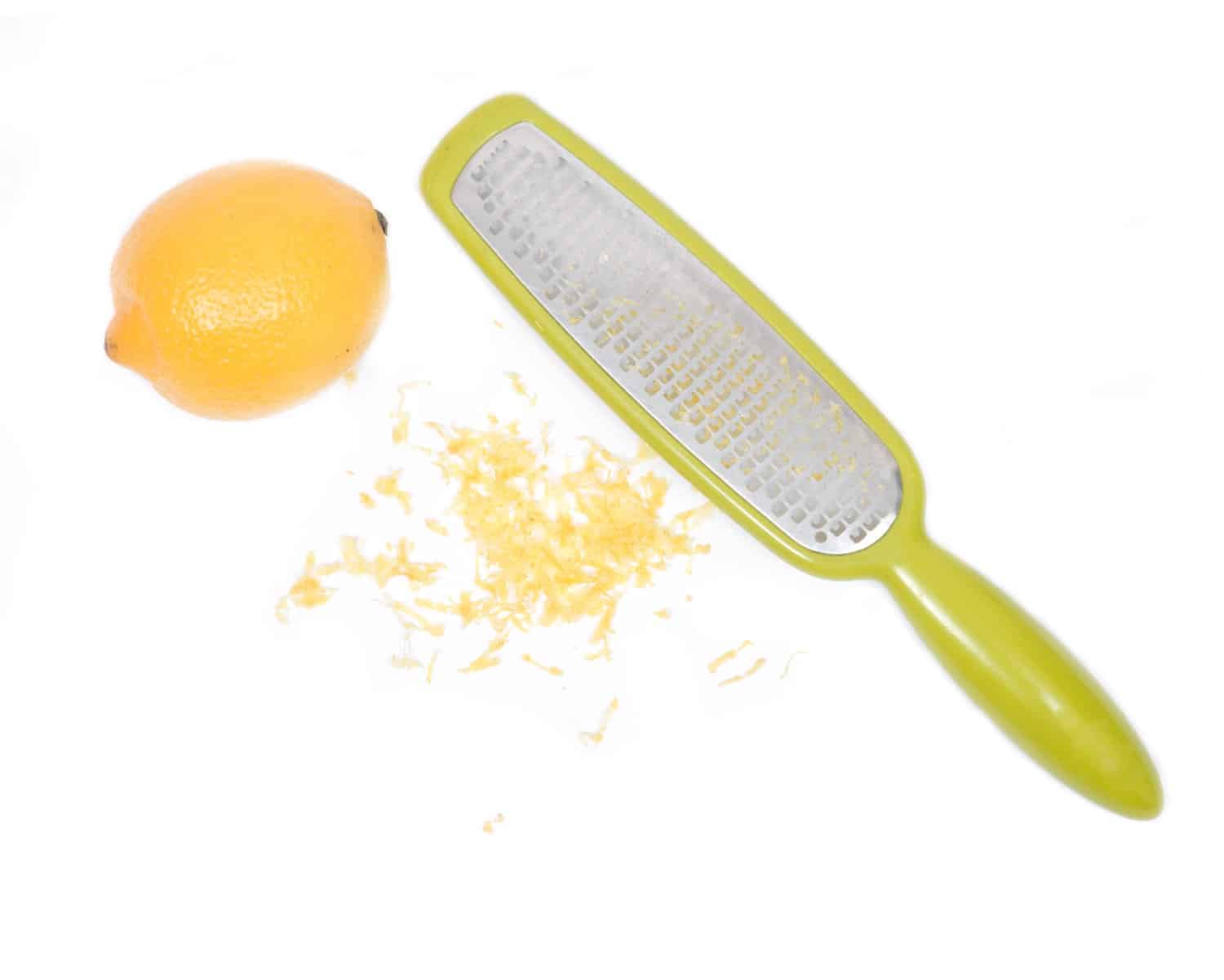 Lemon, lemon zest with microplane or on a white background.