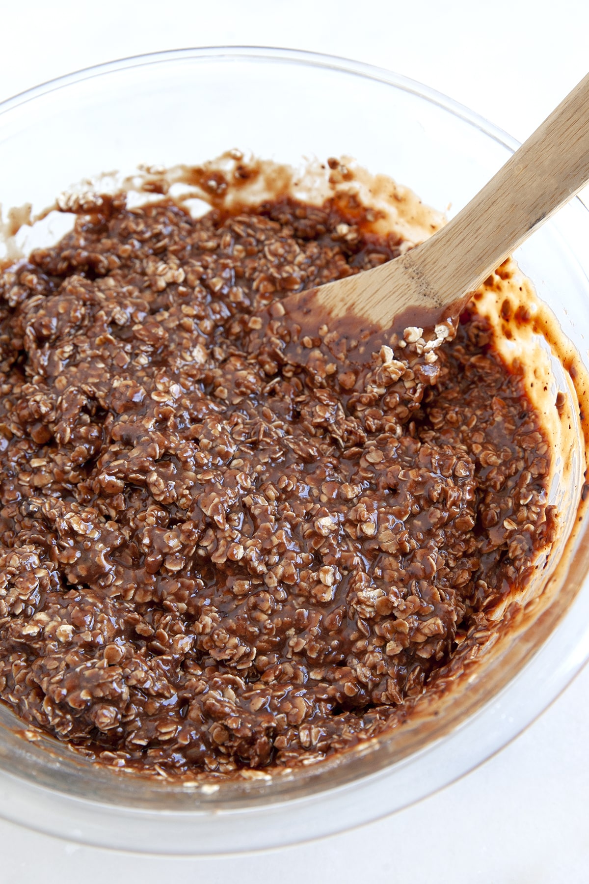 Stirring cookie dough with a wooden spoon. 