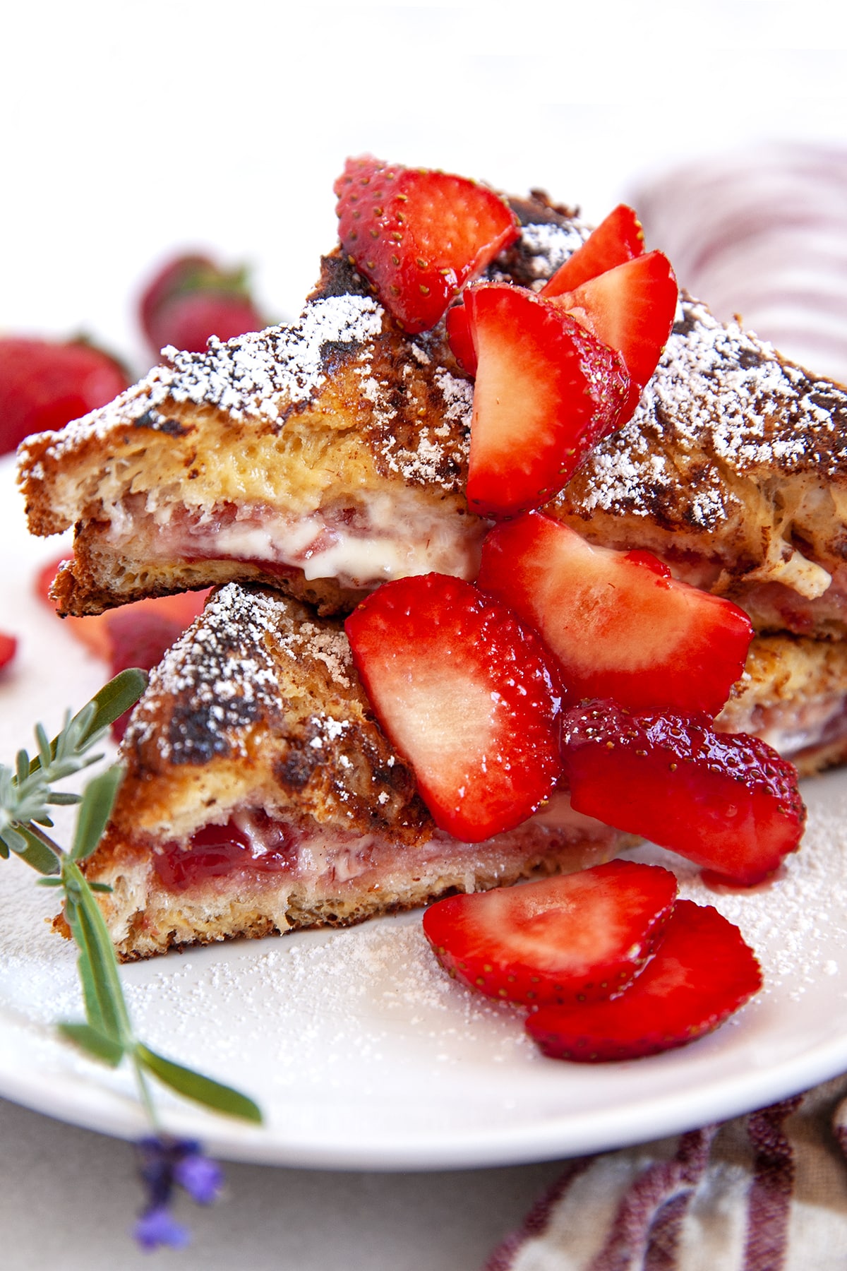 Front close-up view of stuffed French toast with strawberries. 