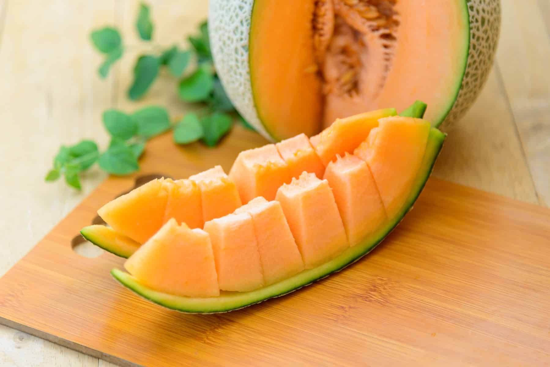 Sliced melon into cubes on the rind. 