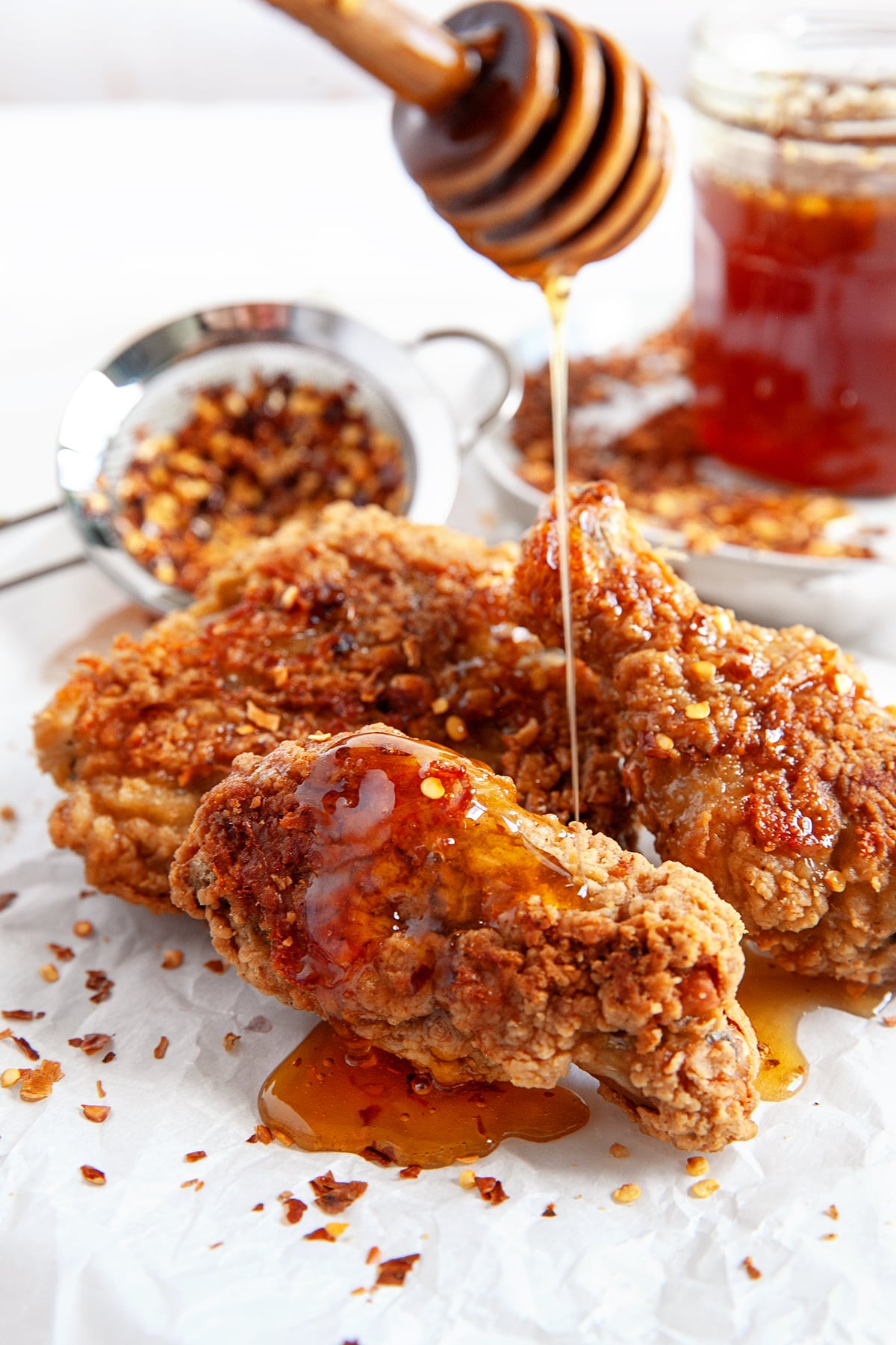 Drizzling hot honey over fried chicken. 