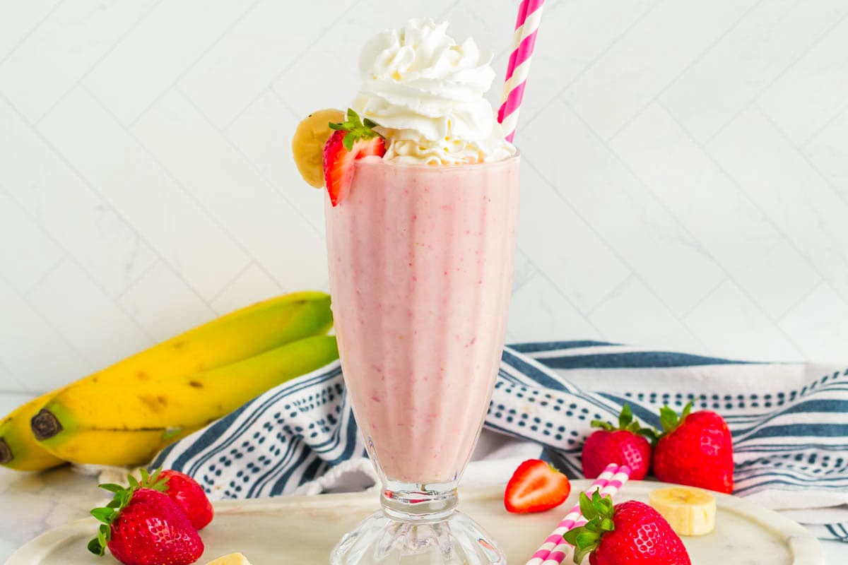 Horizontal photo of a strawberry banana milkshake. 