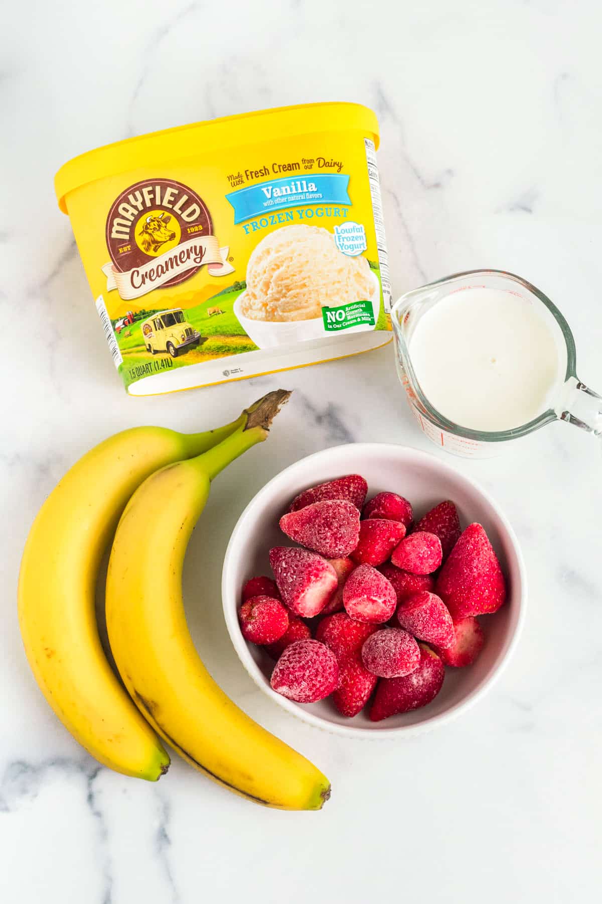 Ingredients for a Strawberry Banana Milkshake. 