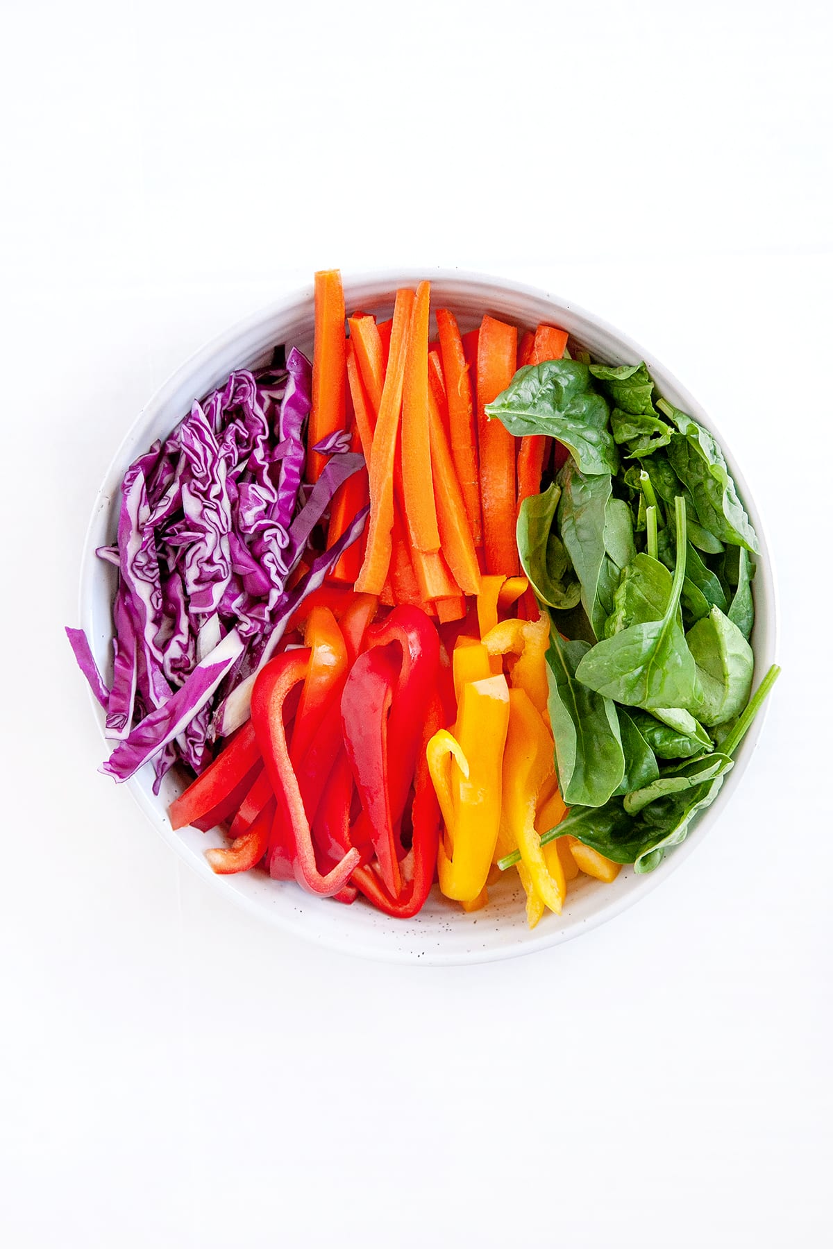 Bright vegetables in a dish like a rainbow.