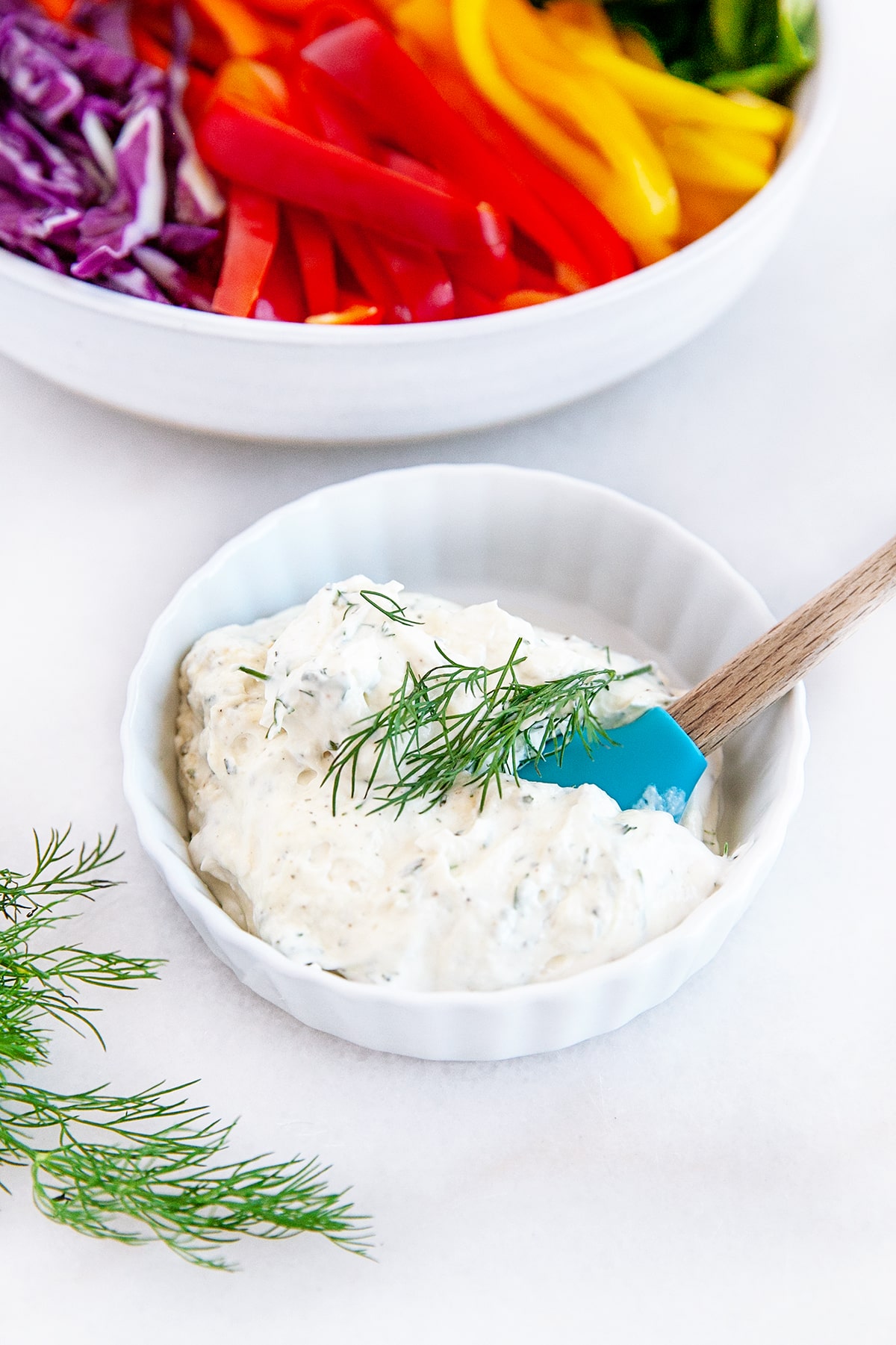 Cream cheese mixture in a small dish with a spatula. 