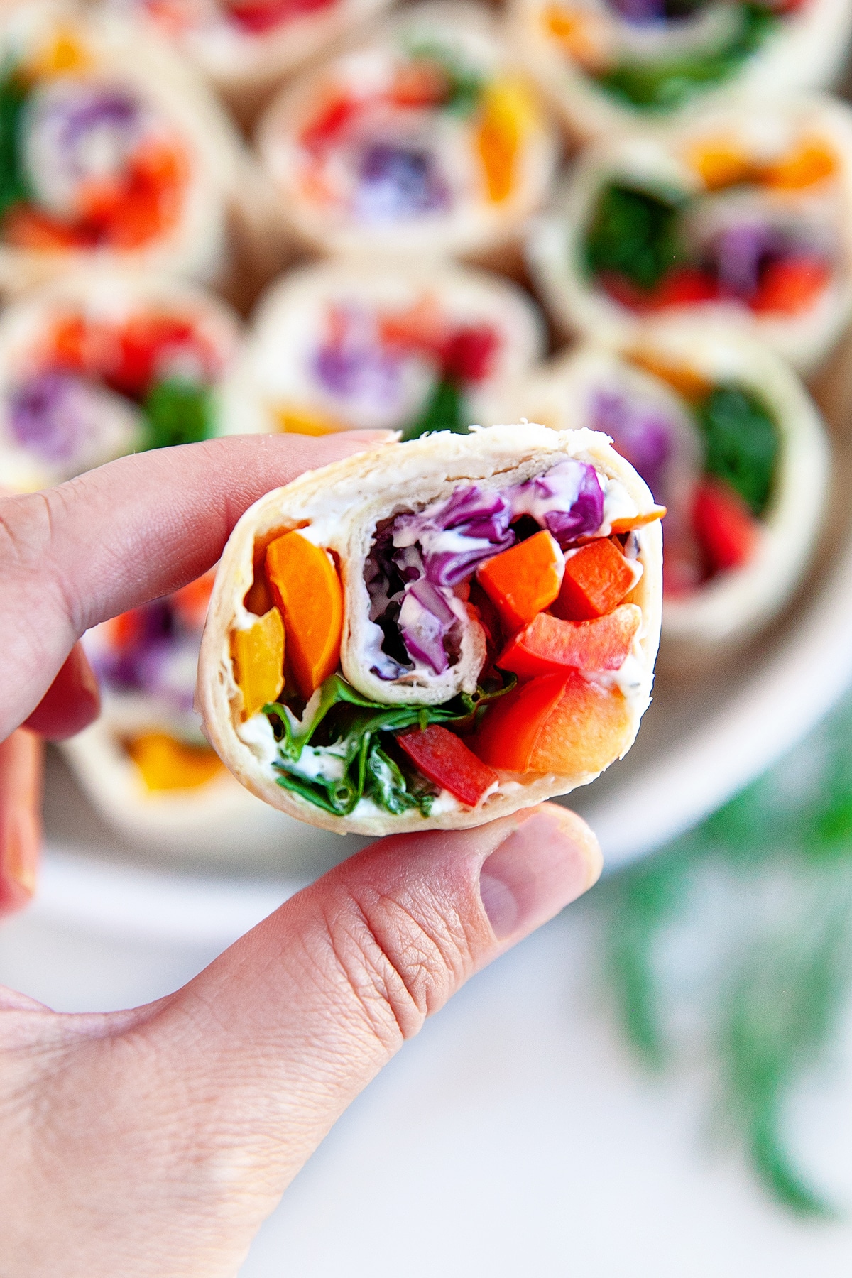 Holding a vegetable pinwheel. 