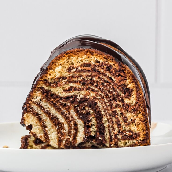 https://noshingwiththenolands.com/wp-content/uploads/2023/07/Zebra-Cake-1200-x-1200-1-735x735.jpg