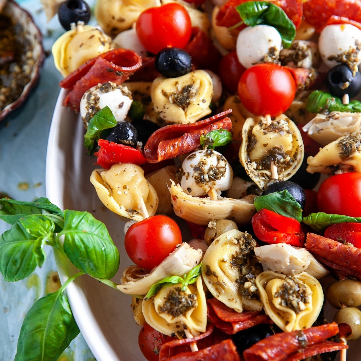 Square photo of a close-up shot of tortellini skewers. 