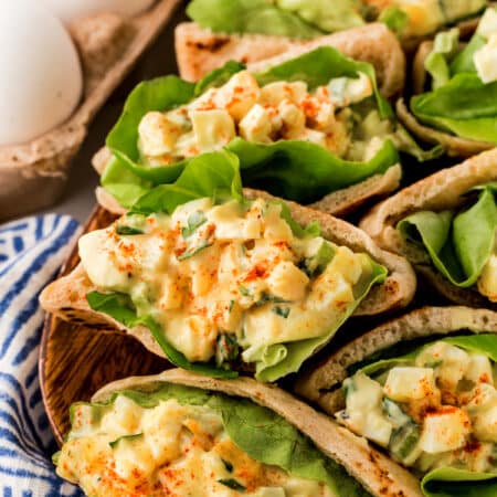 Egg salad pitas on a tray.