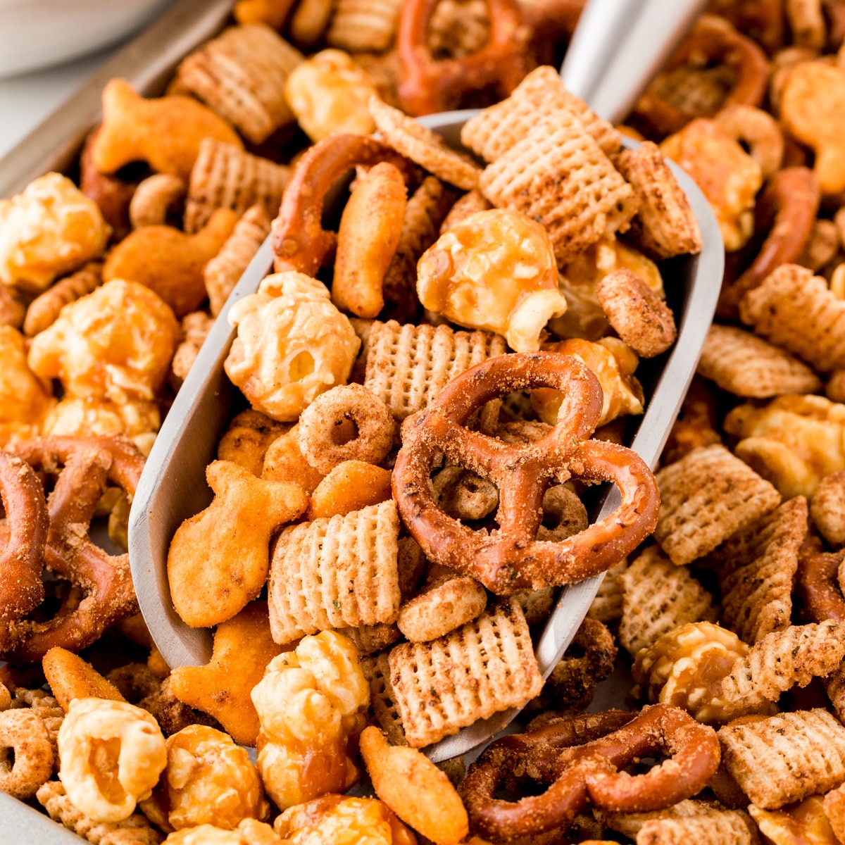 Taking a scoop of Homemade Chex Mix. 