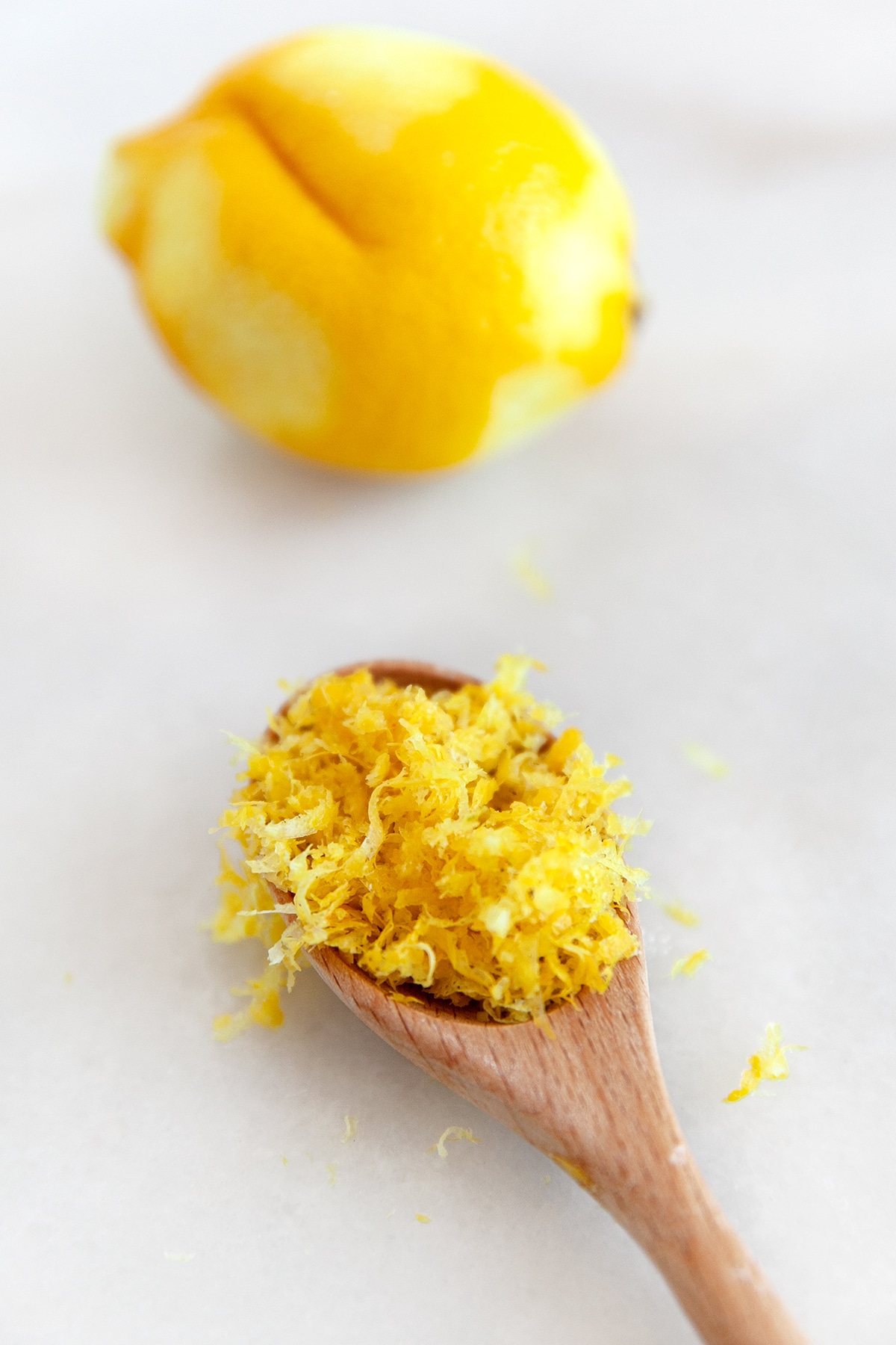 Lemon zest on a wooden spoon. 