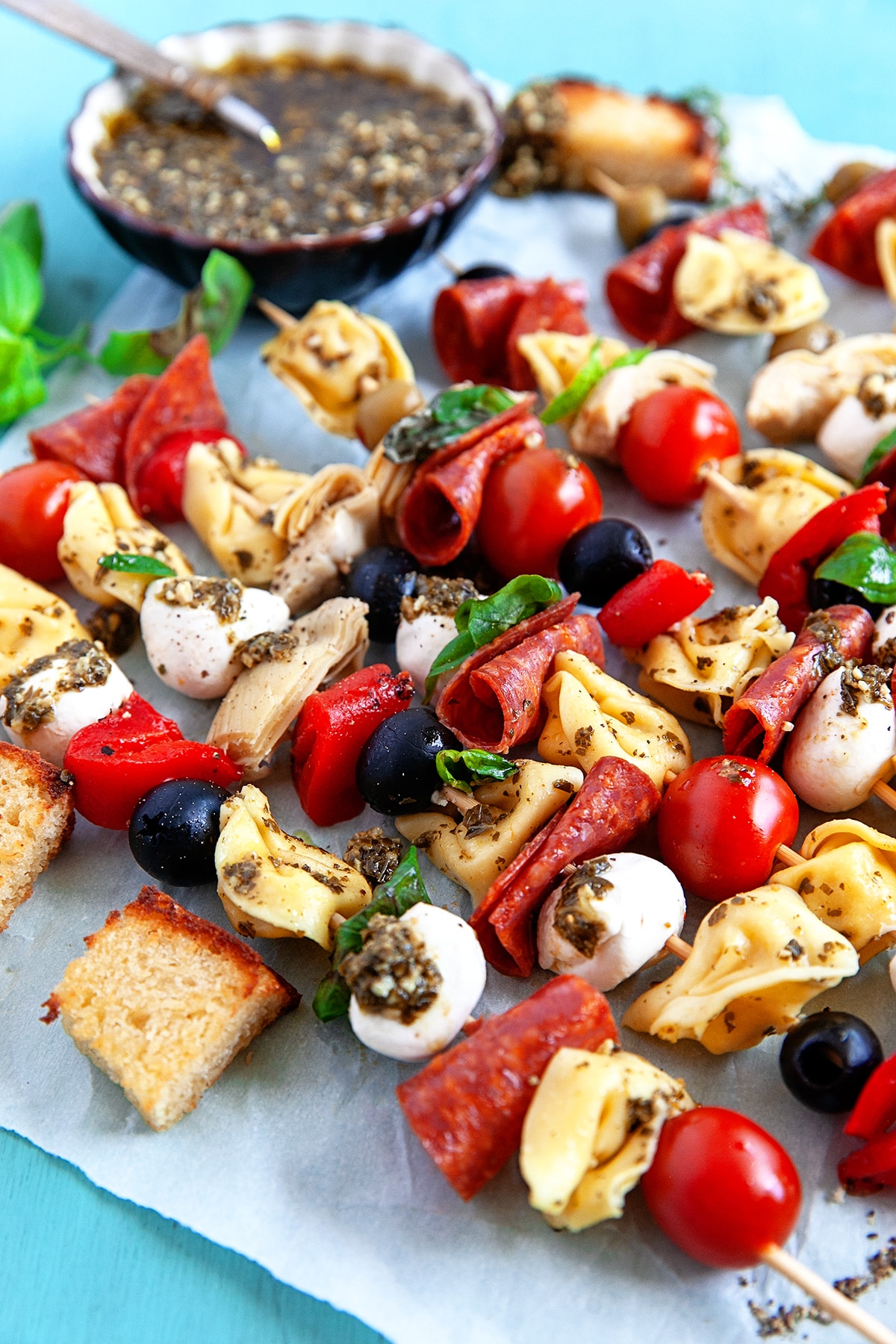 Tortellini Skewers on parchment paper. 