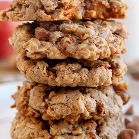 Apple Oatmeal Cookies stacked on a plate.