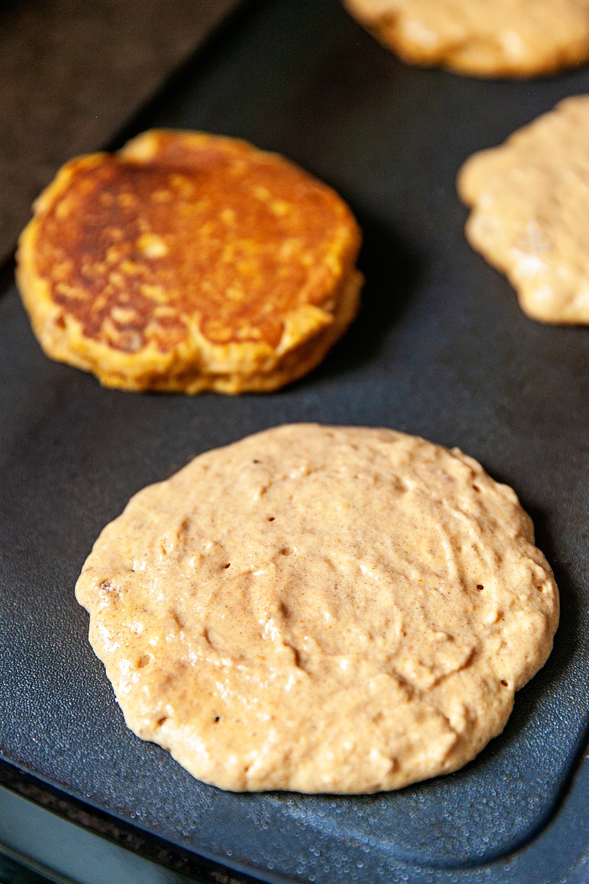 Pumpkin pancakes on the griddle. 