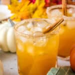 Pumpkin Spice Cocktails with fall foliage and pumpkins.