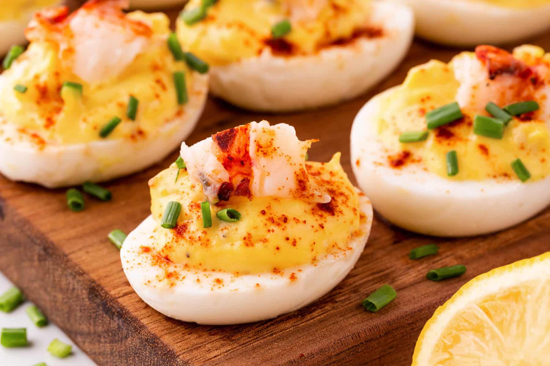 Horizontal picture of deviled eggs on a board. 