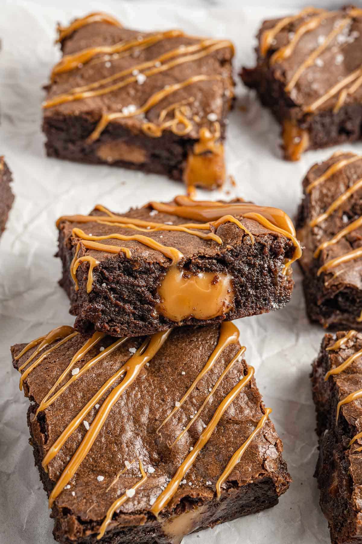 Close-up showing caramel oozing out of a brownie. 