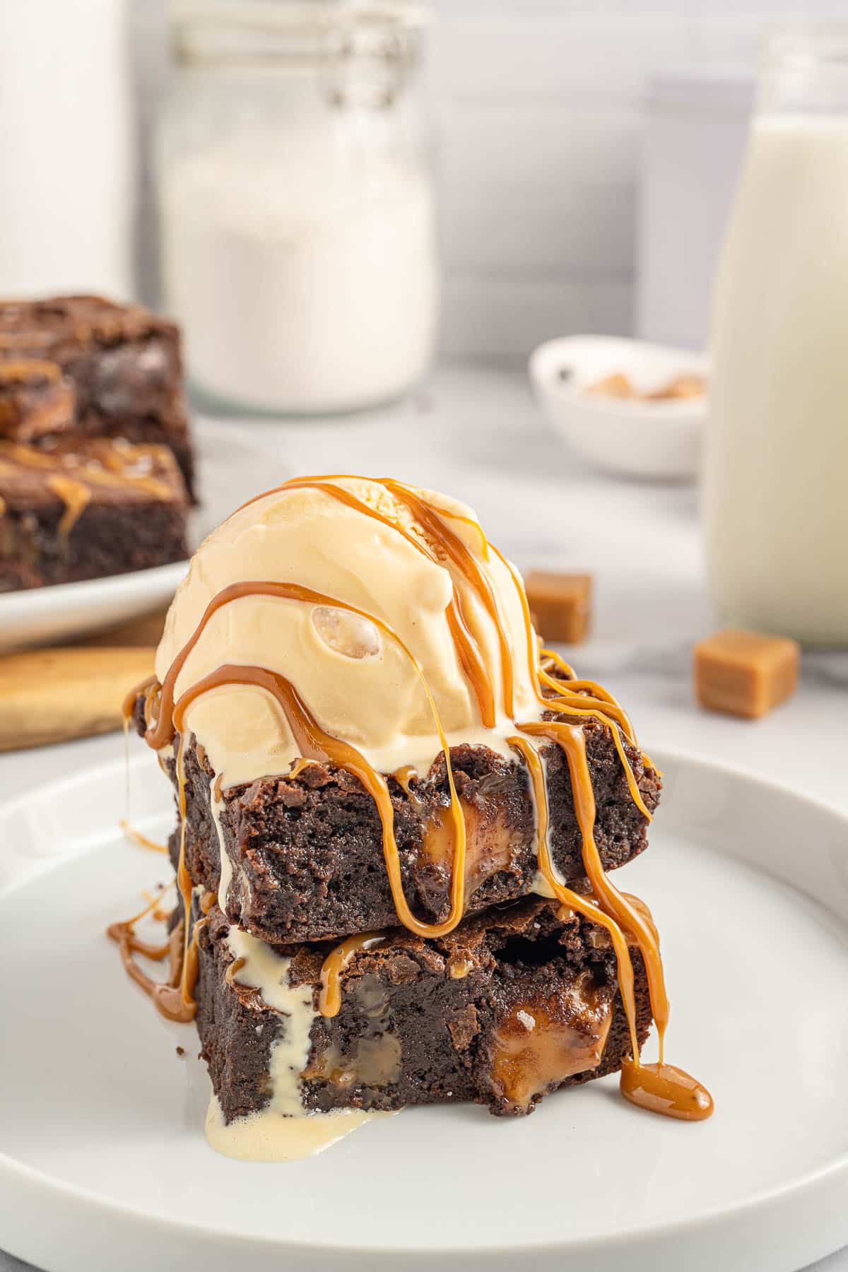 Stacked brownies with ice cream and caramel sauce. 