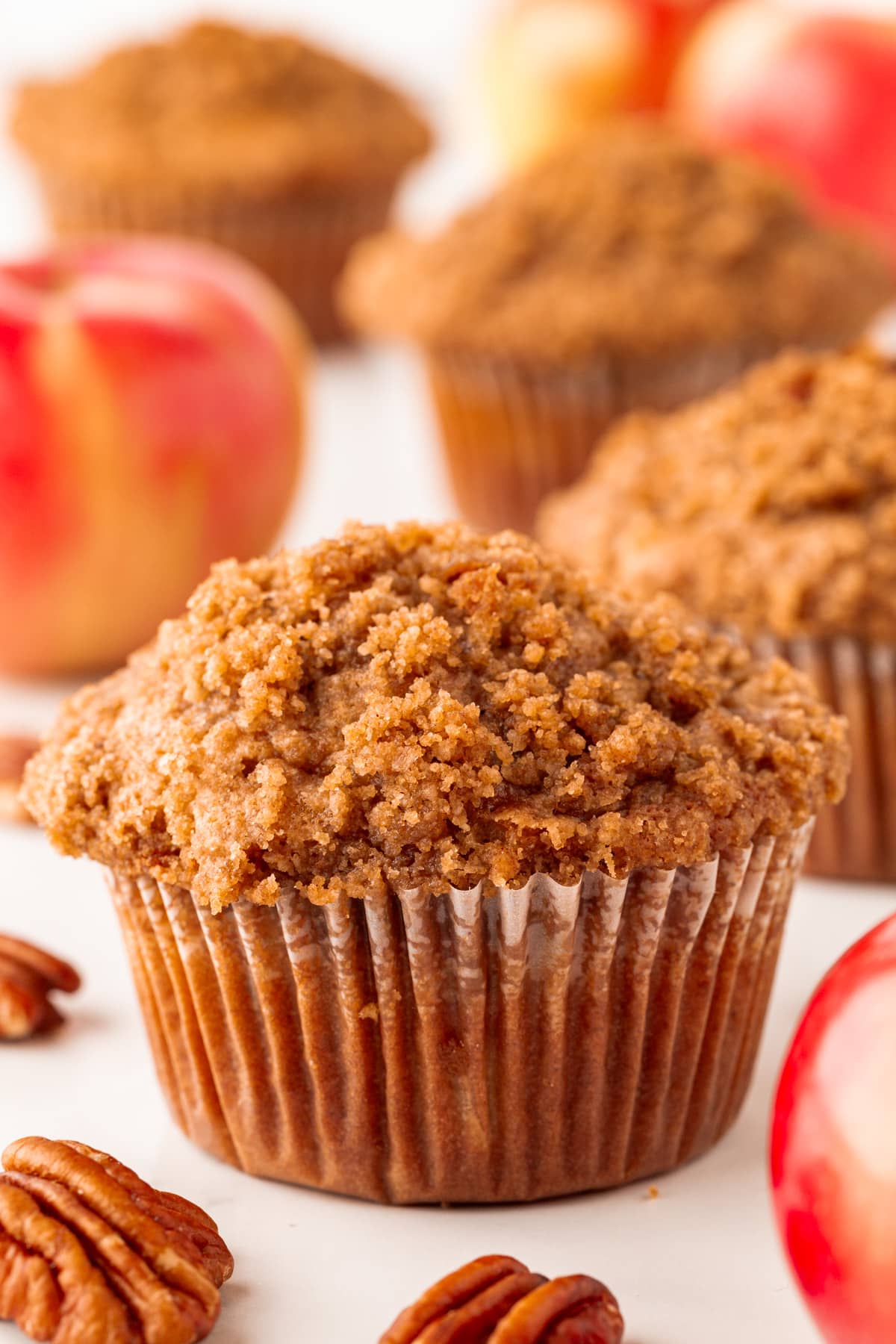Close-up of an apple cranberry muffin with streusel topping. 