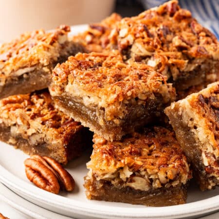 Chewy Pecan Bars on a serving plate.