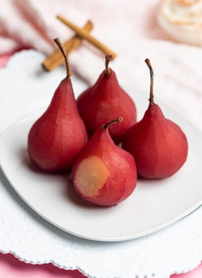 Red Wine Poached Pears on a white plate.