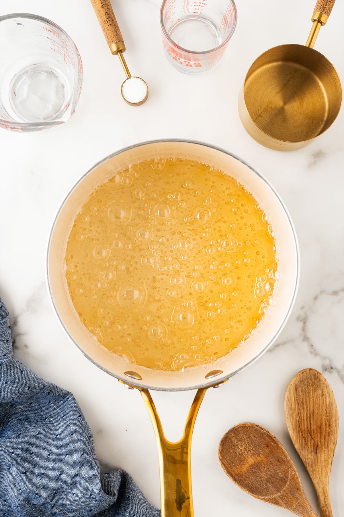 Golden syrup bubbling in a pot. 
