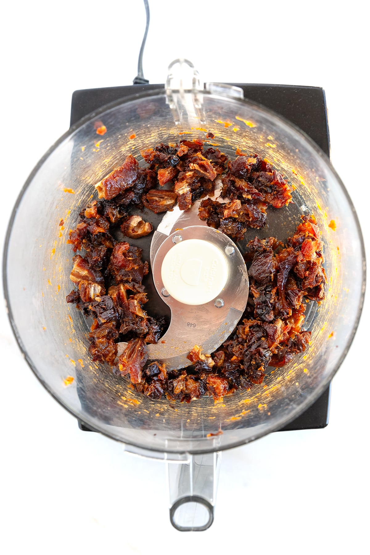 Prunes and dates in a food processor. 