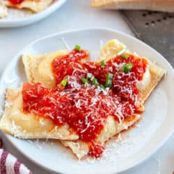 Cheese Ravioli on a plate with Red Pepper Tomato Sauce.