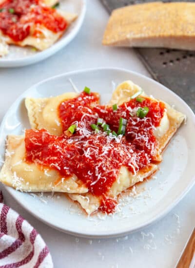 Cheese Ravioli on a plate with Red Pepper Tomato Sauce.